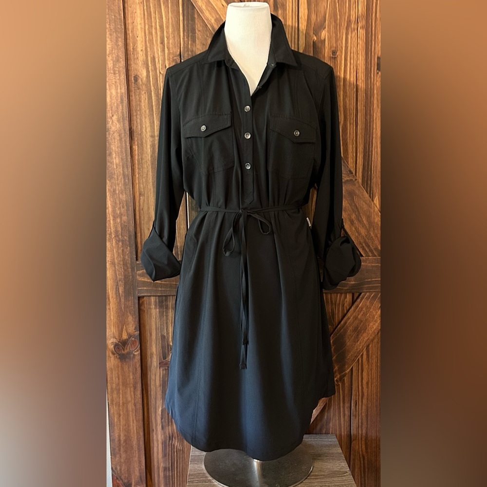Solid black dress. It is the wicking material. It is still dressy.
